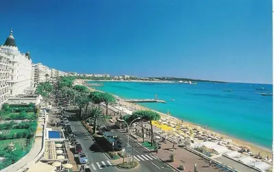 a view of a beach with the ocean and buildings at Superbe Studio in Cannes 450m sea & parking in Cannes