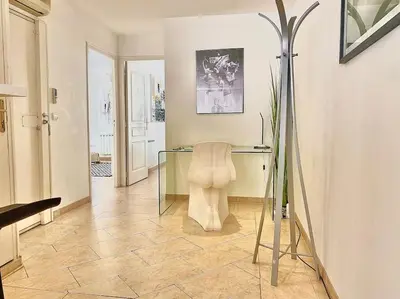 a room with a glass desk and a chair at Appartement Cannes 6 chambres - 8B3 in Cannes