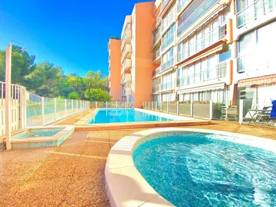 a swimming pool in front of a building at Cannes Les Plages By SCLS Locations in Cannes