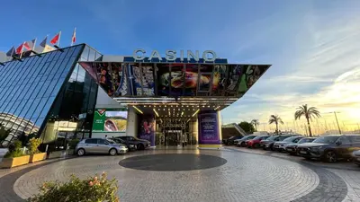 a parking lot with cars parked in front of a casino at Large 2-Room Apartment Cannes - Wifi, Air Conditioning in Cannes