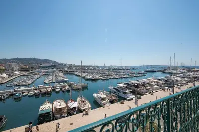 a marina with a bunch of boats in the water at Wow this view! 2BR facing Old Port 4th floor Olam Properties in Cannes