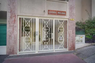 a balcony with a glass table and chairs on it at FRGK Gallieni Terrace Quiet Executive Stay Walk to Palais in Cannes