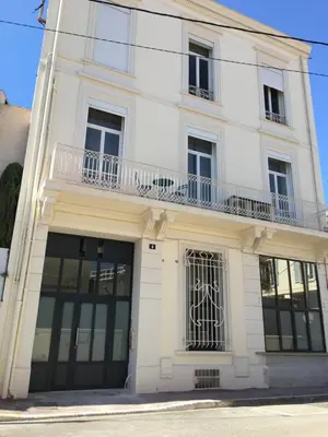 a white building with windows and a balcony at BRP Cannes Center,Two-Bed Deluxe Apart with Spa bath in Cannes