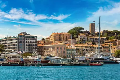 a group of boats docked at a marina in a city at Studio mezzanine in Cannes