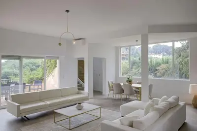 a living room with two couches and a table at Twin Luxurious Villas 8 BR Pool in Vallauris in Vallauris