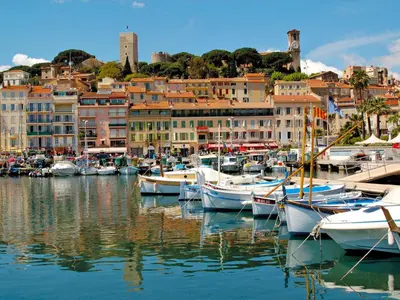 a group of boats docked in a harbor with buildings at Apartment Le Copacabana by Interhome in Cannes