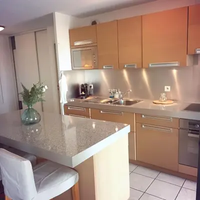 a kitchen with a sink and a counter top at Apt calme 2 chambres vue dégagée in Cannes