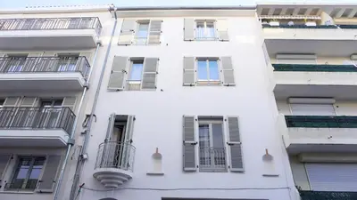 a white building with windows and balconies at Proche Carlton & Croisette, Appartement 303 in Cannes