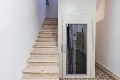 a building with orange signs on the side of it at Studio W - Ascenseur - 2 min du Palais - Climatisé in Cannes
