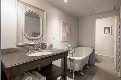 a bathroom with a tub and a sink and a bath tub at Hotel particulier Croisette in Cannes