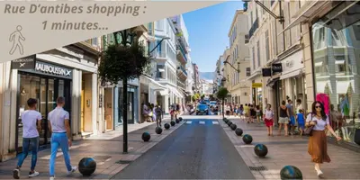 a group of people walking down a city street at 1 Chambre Cosy - 4 min du Palais - Wi-Fi - Climatisé in Cannes