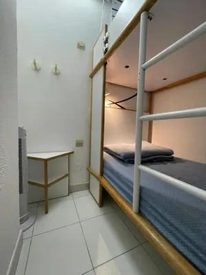 a small room with a bunk bed and a desk at Appartement Cannes, Piscine - Terasse - 4 Personnes in Cannes