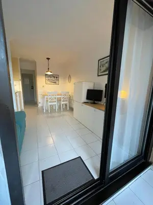 a view of a living room and a dining room at Appartement Cannes, Piscine - Terasse - 4 Personnes in Cannes