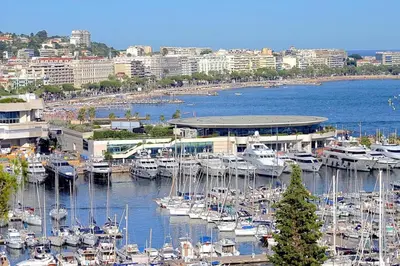 a group of boats docked at a marina in a city at Peaceful villa with pool and garden - 5 minutes from Cannes beaches in Cannes