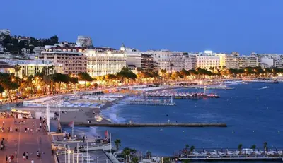 a view of a city with a beach and buildings at Mediterranean Cosy Studio in Cannes