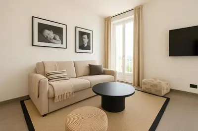 a living room with a couch and a table at French Dolce Vita near Croisette in Cannes