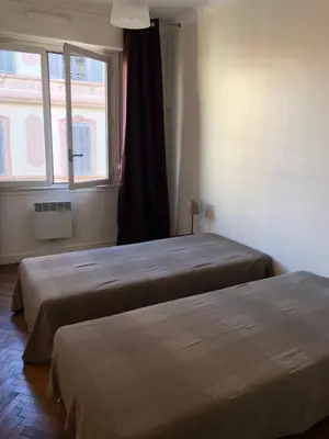 a bathroom with a shower and a tub and a toilet at Merimee 3D in Cannes