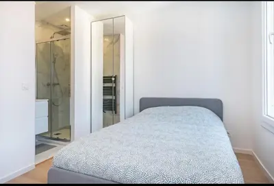 a bedroom with a bed and a walk in shower at Cannes Hoche Croisette Sublime T2 in Cannes
