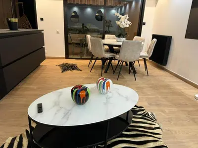 a living room with a white table and chairs at Prestigious apartment in Cannes in Cannes