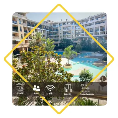 a sign with a view of a resort at Le Beach 1 min plage , piscine , terrasse in Cannes