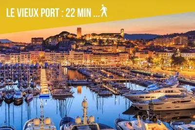 a group of boats docked in a marina at night at Elégant 3 pièces avec Terrasse - Centre - Lumineux in Cannes