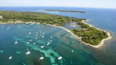an aerial view of a island with boats in the water at CG Armenonville White in Cannes