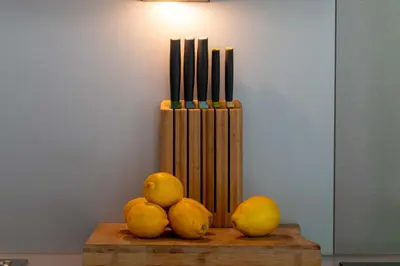 a pile of oranges and lemons on a wooden table at 1-Br Garden Apartment with Pool Peaceful Private Parking in Cannes