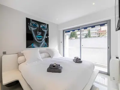 a living room with a couch and a table at Beautiful Apartment with Balcony 1BR 2P - Cannes in Cannes