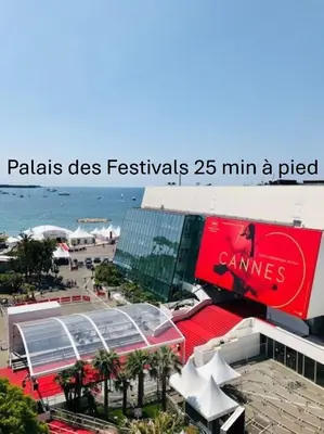 a building on the beach with a coca cola sign at Modern 2 Chambres-TERRASSE-POINTE CROISTTE-PALM BEACH A2B267 in Cannes
