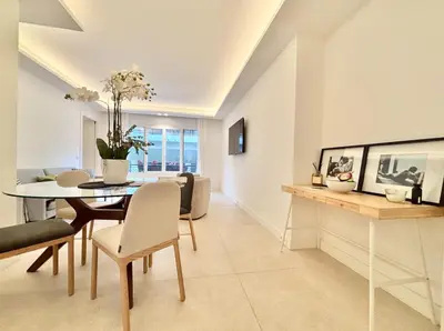 a dining room and living room with a table and chairs at Cannes 2x2 bedrooms apartment - 24P3 in Cannes