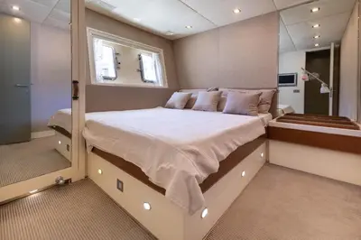 a large bed in the middle of a room at Votre Palace Flottant sur la Croisette à Cannes in Cannes