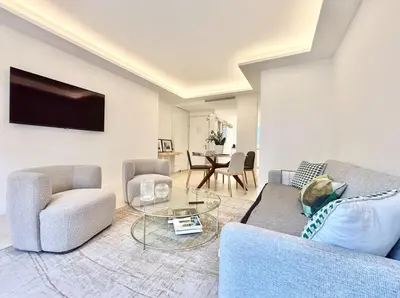 a living room with a couch and two chairs and a table at Cannes - 2 bedrooms & 2 bathrooms apartment - 24P1 in Cannes