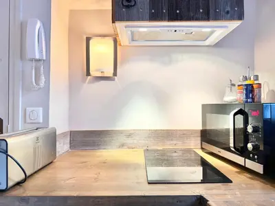 a kitchen with a counter top in a room at Elegant studio à Cannes - Suquet - 2 people in Cannes