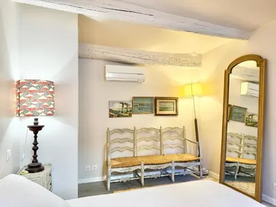 a bedroom with a mirror and a bed at Elegant studio à Cannes - Suquet - 2 people in Cannes