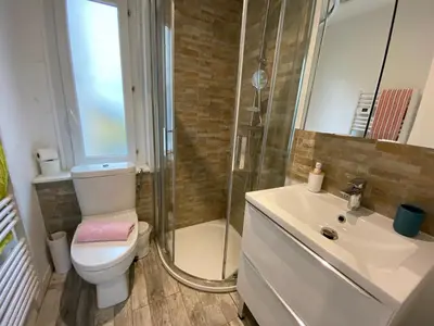 a bathroom with a toilet and a shower and a sink at Atelier & Galerie in Cannes