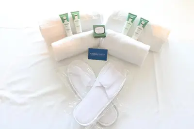 a set of towels and toothbrushes on a bed at Amazing sea view 2 bedroom beach front 303 in Cannes