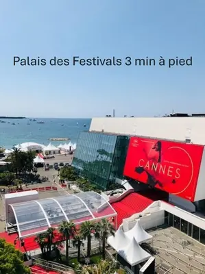 a building on the beach next to the ocean at Superbe Duplex TERRASSE vue MER, FELIX FAURE- FORVILLE A1B059 in Cannes
