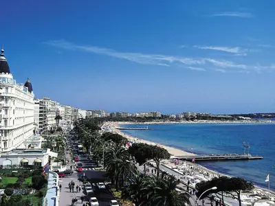 a view of a city with a beach and the ocean at Apartment Riviera Park-1 by Interhome in Cannes