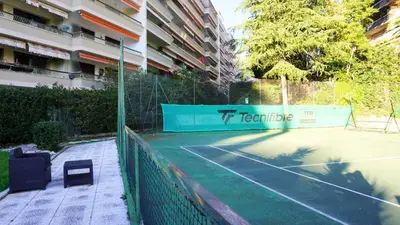 a tennis court in front of a building at Proche Croisette, Studio Cosy by Palmazur in Cannes