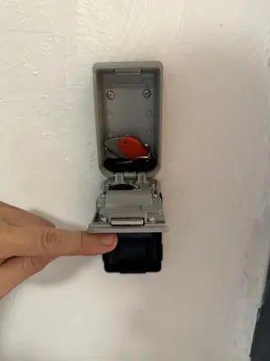a hand pointing at a light in a wall at Lion's Room - 2 minute walk from Palais des Festivals and Beaches in Cannes