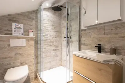 a bathroom with a shower and a toilet and a sink at Atelier Duplex in Cannes