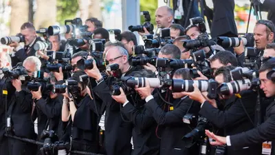 a group of journalists filming with cameras at Carre Ginger in Cannes