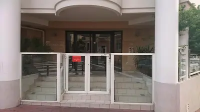 an entrance to a building with a revolving door at Nicolas 8 in Cannes