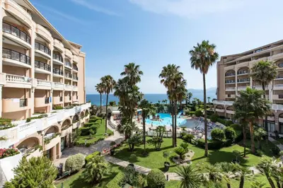 an aerial view of a resort with a pool and palm trees at Résidence Cannes Verrerie - maeva Home - Studio 5 personnes Selection MAE-7337 in Cannes