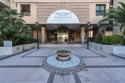 a building with a fountain in front of a building at Résidence Cannes Verrerie - maeva Home - Studio 5 personnes Selection MAE-7337 in Cannes