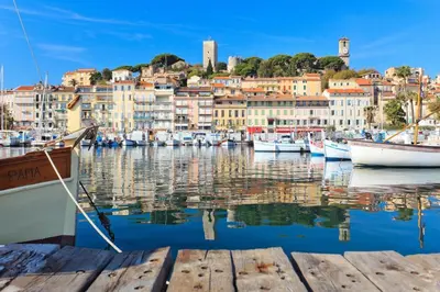 a group of boats docked in a harbor with buildings at Beautiful and cozy apartment in the heart of Cannes in Cannes