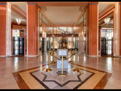 a museum with a statue in the middle of a building at Cannes Croisette Majestic Miramar in Cannes