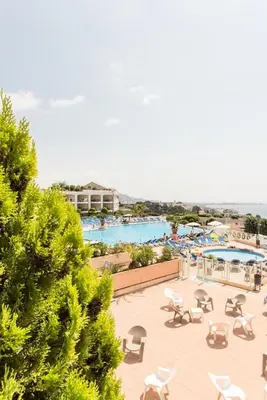 a view of a swimming pool with chaise lounge chairs at Résidence Cannes Villa Francia - maeva Home - Appartement 2 pièces 6 personnes avec très belle vue mer - Prestige - super Home MAE-6260 in Cannes