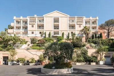 a large building with a tree in front of it at Résidence Cannes Villa Francia - maeva Home - Studio 4 personnes - Sélection MAE-6353 in Cannes