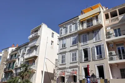 a row of tall buildings in a city at C005-Studette au centre Cannes in Cannes
